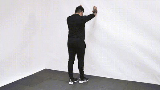 Standing quad stretch demonstration